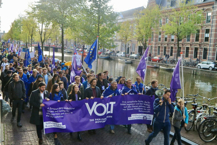 Volt parade in Amsterdam with flag